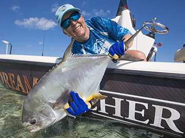 Flats fishing, anglers hold up a nice permit. 